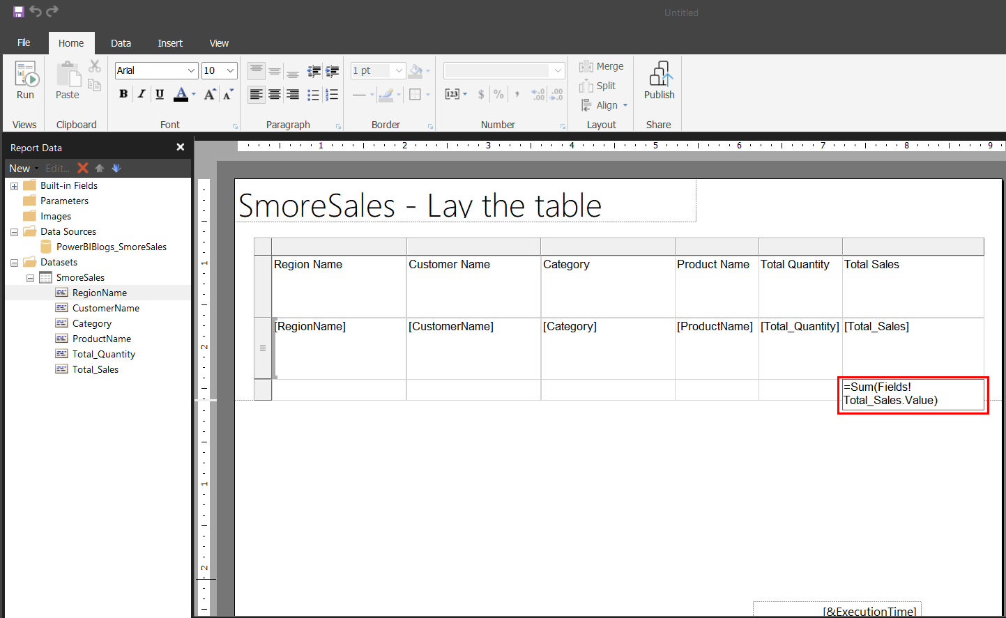 Report Builder design surface showing the new total row added below the detail row, with the expression =Sum(Fields!Total_Sales.Value) entered in the rightmost cell under Total Sales.