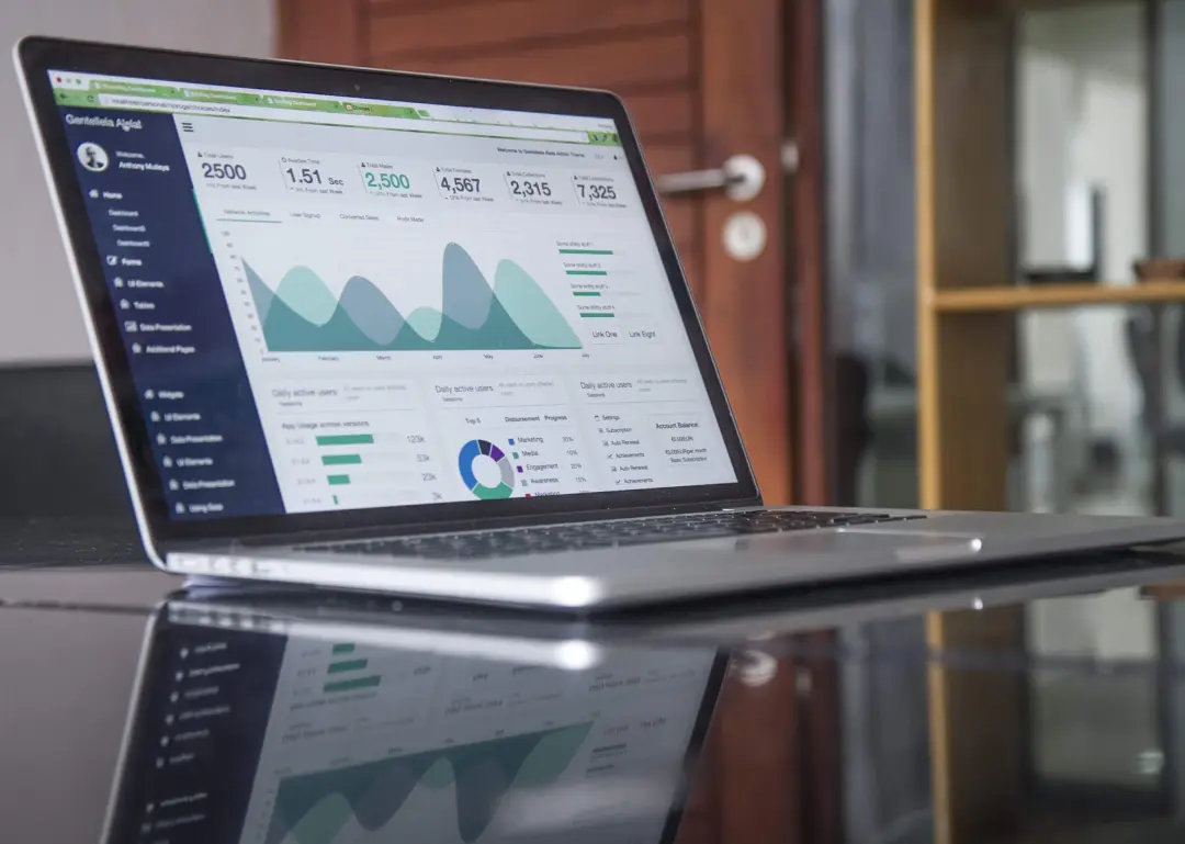laptop with financial dashboard display