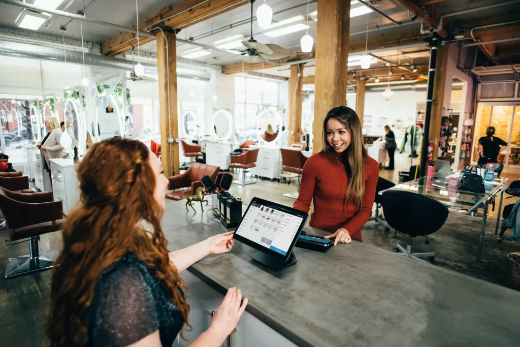 two women working together on computers